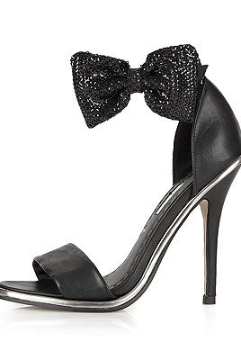 <p>Ooooh, pretty shoes! These beauts are perfect for part season and super flattering too. Plus, we love shoes that are firmly attached via ankle strap. Means you won't lose 'em on the dance floor.</p>
<p>RULE Strappy Bow Sandals, £50, <a title="http://www.topshop.com/webapp/wcs/stores/servlet/ProductDisplay?beginIndex=1&viewAllFlag=&catalogId=33057&storeId=12556&productId=8373059&langId=-1&sort_field=Relevance&categoryId=277012&parent_categoryId=208491&pageSize=200&refinements=Colour{1}~[black|white]&noOfRefinements=2" href="http://www.topshop.com/webapp/wcs/stores/servlet/ProductDisplay?beginIndex=1&viewAllFlag=&catalogId=33057&storeId=12556&productId=8373059&langId=-1&sort_field=Relevance&categoryId=277012&parent_categoryId=208491&pageSize=200&refinements=Colour{1}~[black|white]&noOfRefinements=2" target="_blank">Topshop</a></p>
<p><a title="http://www.cosmopolitan.co.uk/fashion/shopping/fashion-christmas-gift-guide" href="http://www.cosmopolitan.co.uk/fashion/shopping/fashion-christmas-gift-guide" target="_blank">FANCY WINNING A WHOLE LOT OF FASHION GOODIES?</a></p>