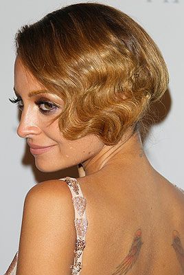 <p>Talk about a blast from the past - Nicole Richie flaunted an iconic 20s flapper-girl hairstyle this party season. How fab!</p>
<p>To get the look, Sebastian Professional UK ambassador Adam Reed recommends using <a href="http://www.feelunique.com/p/Sebastian-Professional-Thickefy-Foam-200ml?utm_source=GoogleBaseUK&utm_medium=gen" target="_blank">Sebastian Professional Thickefy Foam</a> on the hair before blow-drying. Section the hair from the top of one ear to the other,pull that section forward and put the rest of the hair into a side ponytail</p>
<p>Using a wand or tong, curl the front section and brush out to create a wave. Clip the front section into the side ponytail and finish with <a href="http://www.sebastianprofessional.com/en_US/products/flaunt/product.jsp?id=100034" target="_blank">Sebastian Professional Shine Define Spray </a></p>