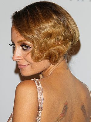 <p>Talk about a blast from the past - Nicole Richie flaunted an iconic 20s flapper-girl hairstyle this party season. How fab!</p>
<p>To get the look, Sebastian Professional UK ambassador Adam Reed recommends using <a href="http://www.feelunique.com/p/Sebastian-Professional-Thickefy-Foam-200ml?utm_source=GoogleBaseUK&utm_medium=gen" target="_blank">Sebastian Professional Thickefy Foam</a> on the hair before blow-drying. Section the hair from the top of one ear to the other,pull that section forward and put the rest of the hair into a side ponytail</p>
<p>Using a wand or tong, curl the front section and brush out to create a wave. Clip the front section into the side ponytail and finish with <a href="http://www.sebastianprofessional.com/en_US/products/flaunt/product.jsp?id=100034" target="_blank">Sebastian Professional Shine Define Spray </a></p>