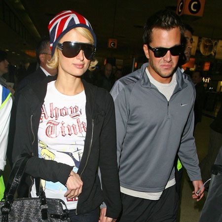 Paris Hilton was showing her love for the UK with her Union Jack hat as she headed to Heathrow with boyfriend <a target="_blank" href="men/man-watch/gallery">Doug Reinhardt</a>. The heiress spent her brief break over here parting at almost every single exclusive club in London...  <br />