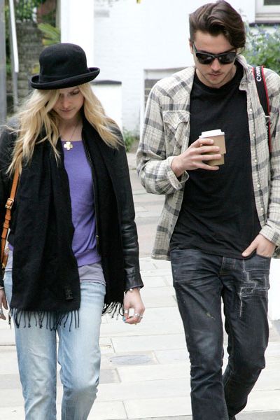 Fearne Cotton has gone all Charlie Chaplin on us in a black bowler hat as she strolled through leafy Hampstead with a mystery male companion...