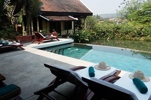 Swimming pool, Property, Furniture, Outdoor furniture, Resort, Real estate, Sunlounger, House, Roof, Thatching, 