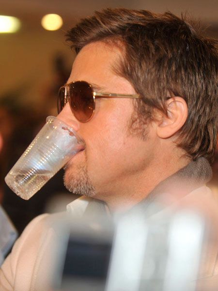 At a party in Cannes, Brad Pitt showed that despite his millions he's not above using a plastic beaker if the occasion demands...  <br />