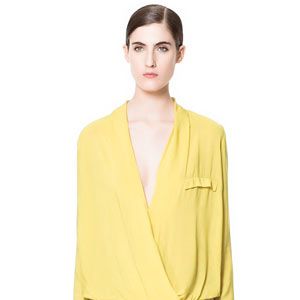 <p>Yellow was everywhere at London Fashion Week, from Rihanna for River Island to Jonathan Saunders. If you're not up for neon yellow, go for pale with this super-feminine draped blouse from Zara with just the right amount of cleavage.</p>
<p>Blouse, £29.99, <a href="http://www.zara.com/webapp/wcs/stores/servlet/product/uk/en/zara-neu-S2013/363008/1121143/DRAPED%20BLOUSE" target="_blank">Zara</a></p>