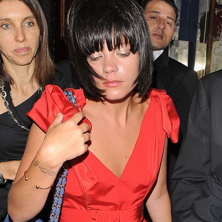 Lily Allen looked slightly worse for wear but stunning in a red frock and Chanel handbag at the fundraiser held at Cafe de Paris in London...  <br />