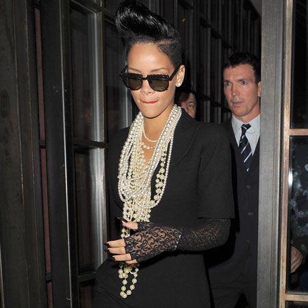 Rihanna showed off her towering quiff which seems to get taller and taller each time we see her. The singer left Shoreditch House in London in the early hours following the after-party for film 'Inglorious Basterds' dressed in black and dripping in pearls...  <br />