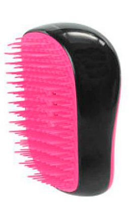 <p>This is the only way to tackle washed-up locks that resemble seaweed. With unique convex teeth, the Tangle Teezer makes detangling pain-free and prevents damage. This mini version will fit in your beach bag no problem.<br />Compact Tangle Teezer, £11.99, <a title="http://www.theukedit.com/tangle-teezer-compact-styler-black/pink/10304139.html" href="http://www.theukedit.com/tangle-teezer-compact-styler-black/pink/10304139.html" target="_self">Cosmo Boutique</a></p>