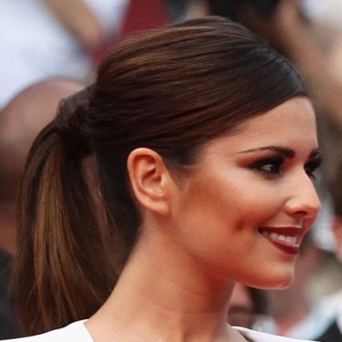 Cheryl looked super-sexy at the Cannes Film Festival with her dramatic makeup and gorgeous sleek ponytail.