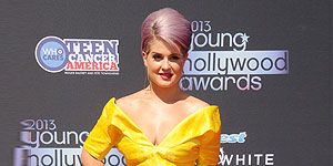 <p>You've got to love Kelly O, there's no other to make bold fashion choices. She went where no one's ventured before by teaming her gorgeous lilac beehive with a vibrant 50s-inspired yellow prom dress. Kelly brought the look up to date with a perspex clutch, gold heels and futuristic triangle drop earrings. Bold.</p>
