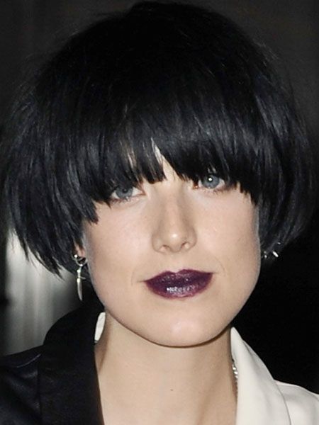 The trend receptive star wears a deep purple lip stain and lends some glamour to the gothic trend