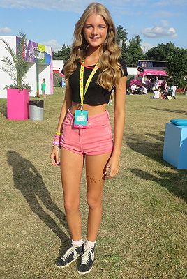 <p>Ellis erred on the right side of girly at V Festival. Showing off her toned, tanned limbs in too-cute pink shorts and a black crop-top, she added to edge to her look with a pair of well-worn Nike Blazers - and we love her frilly ankle socks!</p>