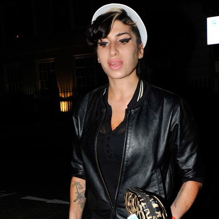 Amy Winehouse, it's not the 80s! We're afraid there's no excuse for that brightly coloured visor that the star was wearing as she popped out for a fish supper on Marylebone high street...
