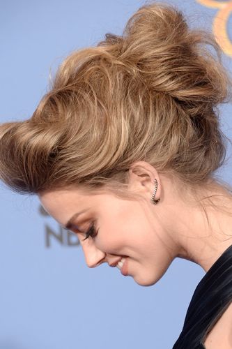 <p>Amber turned heads with a stunning architectural up-do. The baggy quiff, the softly crafted bun and the wispy strands falling loose were a work of art. We also adored her nude lippy which didn't compete with her tresses for the limelight.</p>
<p><a href="http://www.cosmopolitan.co.uk/fashion/news/golden-globes-red-carpet-dresses" target="_blank">GOLDEN GLOBES 2014 RED CARPET PICTURES</a></p>
<p><a href="http://www.cosmopolitan.co.uk/beauty-hair/news/trends/celebrity-beauty/best-golden-globes-hair-makeup-beauty" target="_self">THE EVER BEST GOLDEN GLOBES BEAUTY LOOKS</a></p>
<p><a href="http://www.cosmopolitan.co.uk/beauty-hair/news/trends/celebrity-beauty/celebrity-nail-art-manicures" target="_blank">THE BEST GOLDEN GLOBES NAIL ART PICTURES</a></p>
