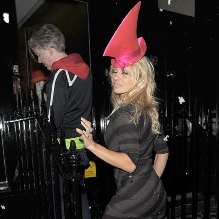 Pamela Anderson may be 44 but the former Baywatch babe sure knows how to party. The blonde star, who is currently appearing as a genie in panto in Wimbledon, was out last night with designer Philip Treacy. The pair visited friends at a private address in Belgravia, popped to Chelsea clutching a bottle of champagne before heading to Treacy's shop nearby and left at 7am! Someone hand the woman an Alka Seltzer...