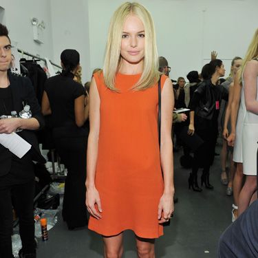 <p>The Calvin Klein fan posed backstage at the label's show working this season's brights trend like no other. That's serious orange appeal...</p>