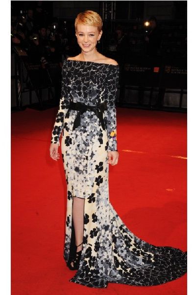Best Actress award winner Carey wowed on the red carpet in a figure flaunting black and white fish tail dress<br />