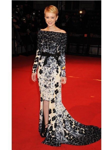 Best Actress award winner Carey wowed on the red carpet in a figure flaunting black and white fish tail dress<br />