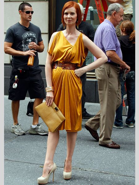 <p>Carrie's not the only one on fine form, we think Miranda's never looked better than in this belted mustard frock and killer platforms</p>