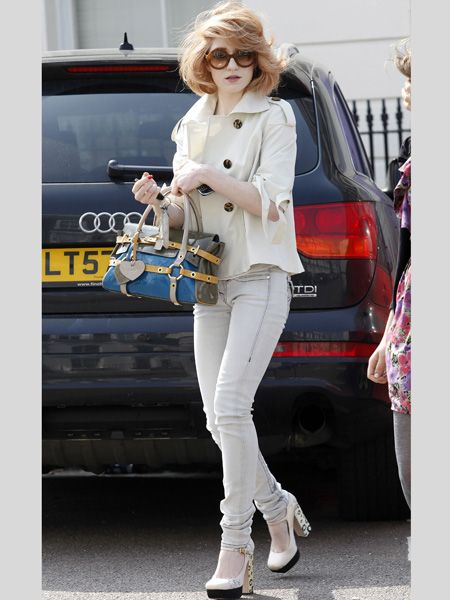 <p>Chezza's band mate Nicola knows that pale and interesting is in - teaming her off-white skinny jeans with a cream jacket and matching platforms </p>
