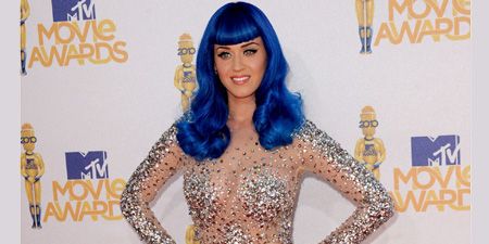 <p>Katy went all out in a sequin encrusted super short shift dress with grey stilettos and an electric blue wig</p>