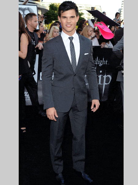 Taylor Lautner looked smokin' as ever in this charcoal suit, giving girls everywhere another reason to reconsider whether they should be Team Edward or Team Jacob <br />