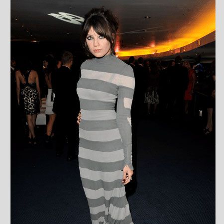 <p>Daisy always wears a maxi marvellously and this trailing hoop striped Gareth Pugh number is no exception. She chose well to wear it un-accessorised for maxi-mum impact</p>
