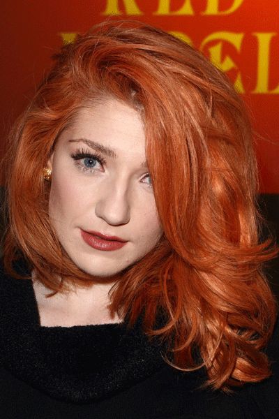 This fiery midi-mane looks absolutely gorgeous on Nicola Roberts. With an exaggerated side parting, effortless waves, and a bright copper hue that shows off her pale complexion to perfection, she definitely looks in vogue for the Vivienne Westwood Red Label show!