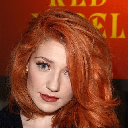 This fiery midi-mane looks absolutely gorgeous on Nicola Roberts. With an exaggerated side parting, effortless waves, and a bright copper hue that shows off her pale complexion to perfection, she definitely looks in vogue for the Vivienne Westwood Red Label show!