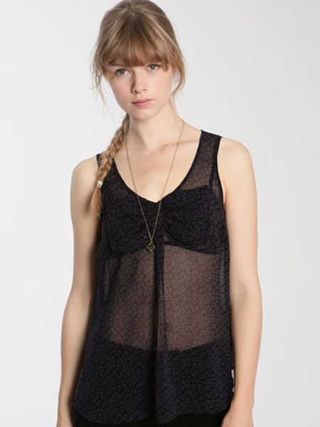 <p>Sheer blouses are sizzling this season. Whilst this won't keep you warm it will look super hot come Saturday night</p>

<p>£38, <a target="_blank" href="http://www.urbanoutfitters.co.uk/Ecote-Sleeveless-Paisely-Bow-Front-Blouse/invt/5110462178742&bklist=icat,5,shop,womens,womenscollections,newforspringwomens">urbanoutfitters.co.uk</a>   </p>