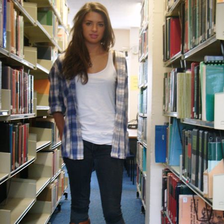 <p>Liz Smith is studying History and International Relations at Exeter and works a cool casual look in the library in jeans, vest top and open check shirt. Love those tan boots!</p>
