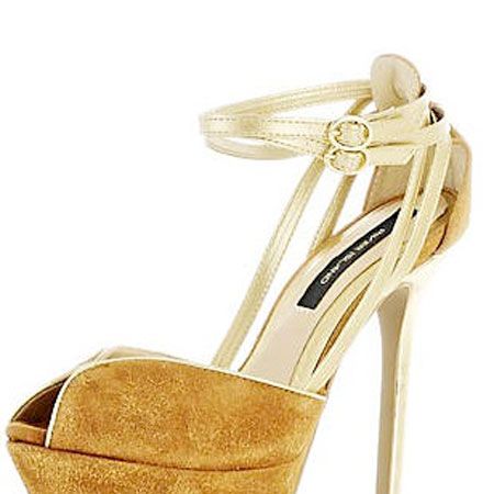 Peep toes and platforms, could these heels be any hotter? The gold trim adds a 70s vibe while the slim stiletto adds a touch of contemporary cool. Wear with thick black tights.<br /><br />£69.99, <a target="_blank" href="http://www.riverisland.com/Online/women/shoes--boots/heels--wedges/brown-peep-toe-platform-shoes-597693">riverisland.com    </a>
