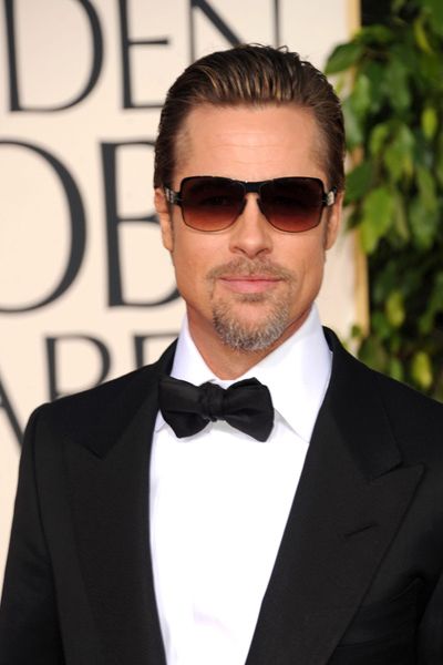 A suave Mr Pitt graces the red carpet at the Golden Globes looking every inch the superstar