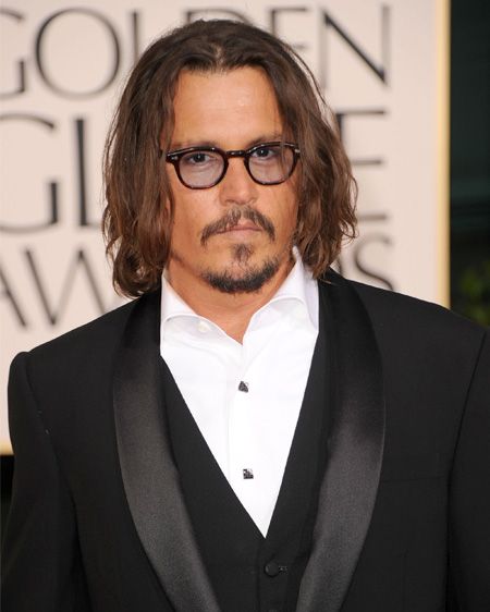 The rough and rugged Johnny Depp opts for an open collar in Ralph Lauren; who needs a bow tie anyway?