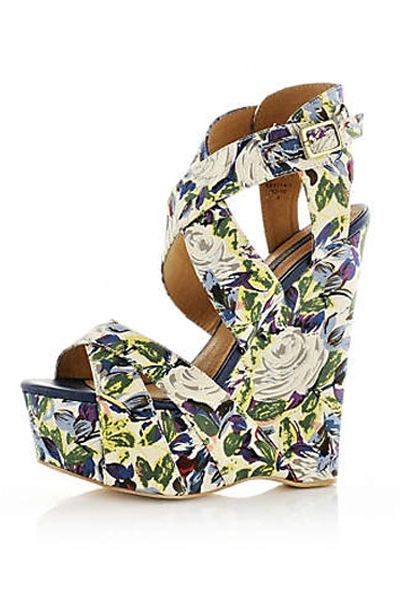 <p>Floral, fun and fabulous, these little beauties tick all the right boxes. Heels will be high this spring summer season and platforms will be presiding a-top fab fashion footwear</p>

<p>£69.99, <a target="_blank" href="http://www.riverisland.com/Online/women/shoes--boots/heels--wedges/blue-print-canvas-wedge-sandals-599714">riverisland.com</a></p>