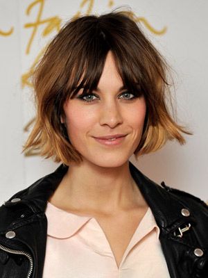 <p>Rarely seen without one, Alexa accessorises her centre parting with a short shaggy bob and feathered fringe</p>