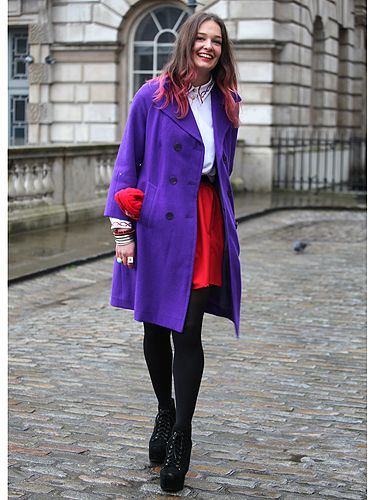 <p>Determined not to let a bit of rain spoil the fashion week fun, this lady wore dazzling colours to match her dip-dyed hair</p>