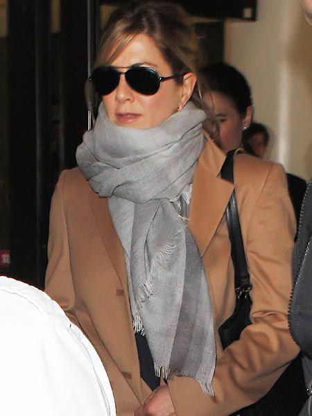 Jennifer Aniston was spotted arriving back at LAX after European promotional work for her Adam Sandler comedy, Just Go With It.

