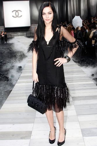 <p>The model-DJ also wore a look from the current Chanel collection at their AW11 show, a stunning feathered trimmed black dress</p>