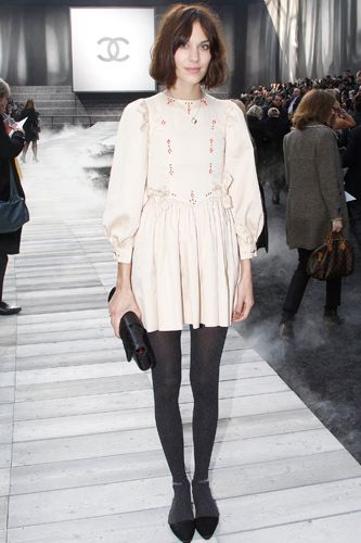 <p>Alexa was also at the hottest show in town wearing a cutesy smock dress with grey tights and pointy flats</p>