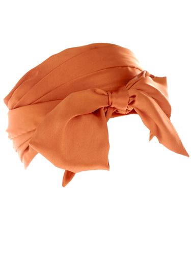 <p>Wrap your head around this beauty for spring. The orange satin bow will add a zesty detail to your wardrobe</p><p>£12, <a href="http://www.asos.com/Asos/Asos-Wide-Headband-Scarf/Prod/pgeproduct.aspx?iid=1480419&cid=4174&sh=0&pge=2&pgesize=20&sort=-1&clr=Tobacco"target="_blank"> asos.com </a></p>
