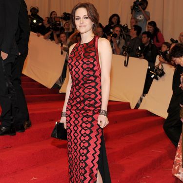 <p>Kristen chose Proenza Schouler for the big bash, wearing a printed red and black column dress by the design duo. A bold choice which may split opinion</p>