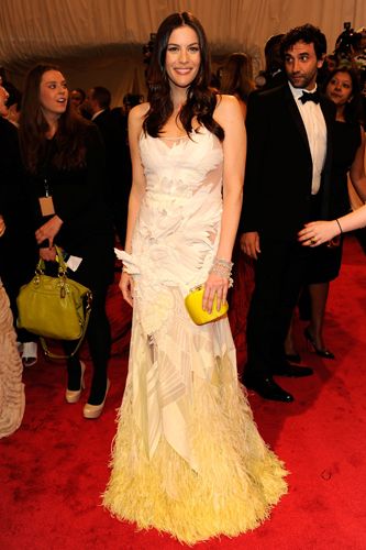 <p>Liv wore a gorgeous Givenchy Haute Couture by Riccardo Tisci gown which graduated from white to lemon yellow at the ostrich feather embroidered hem. A sunny delight!</p>