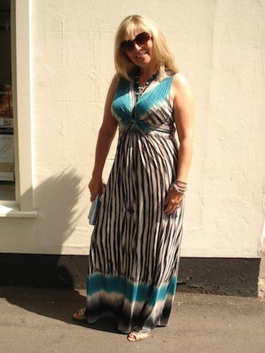 Sarah looked absolutely stunning in this figure-hugging maxi from Maille Demoselle (loyally purchased in her mum's shop), but it's the peeptoe Guccie wedges hidden underneath that really finish it off!