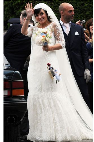 Lily was every inch the beautiful bride in a full-length lace dress created especially for her by French designer Delphine Manivet
