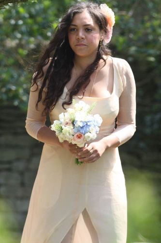 TV presenter and Lily's childhood pal Miquita Oliver was one of the bridesmaids for her big day and wore a nude dress with oversized flowers in her hair
