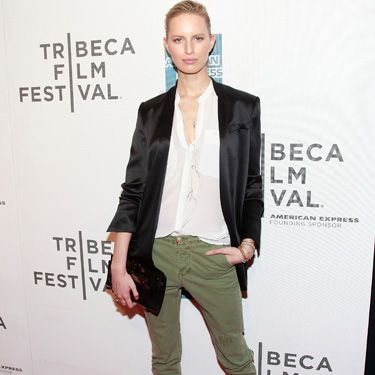<p>Very elegant mix for Karolina Kurkova! She presents a casual chic look with her black satin suit and her tight and short khaki trousers which lengthen her never-ending legs. She looks smart and sophisticated not wearing much but playing with the sizes and neatly pulling her hair back</p>