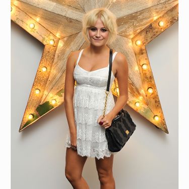 <p>Showing off her new bob hairstyle was pop cutie Pixie Lott in a lace white bustier cocktail dress by Dolce&Gabbana. We love how she's toughened up the look with chunky black boots and her trademark smudgy eye makeup</p>