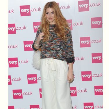 <p>Whitney Port will be selling her own clothing line, Whitney Eve on <a href="http://www.very.co.uk/web/en/celebrity-style.page">very.co.uk</a> from October and came to London to show Fearne Cotton support at her show. She worked the 70s trend in these super wide white flares and check out her fluffy bag!</p>