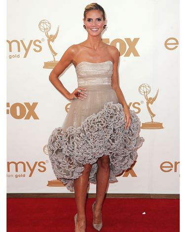 <p>Heidi Klum decided bigger was better this year, opting for a hugely ruffled nude gown by Christian Siriano. How best to play down this look? Simple Louboutins and a classy up-do</p>