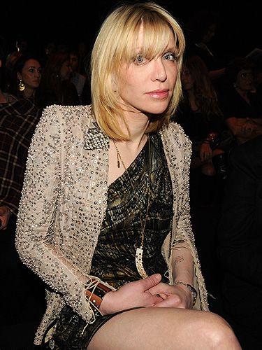 Actually forget Lindsay Lohan, the original hot-mess has arrived! Courtney Love took her place at the Roberto Cavalli show. We have to say, she's looking pretty good!
 